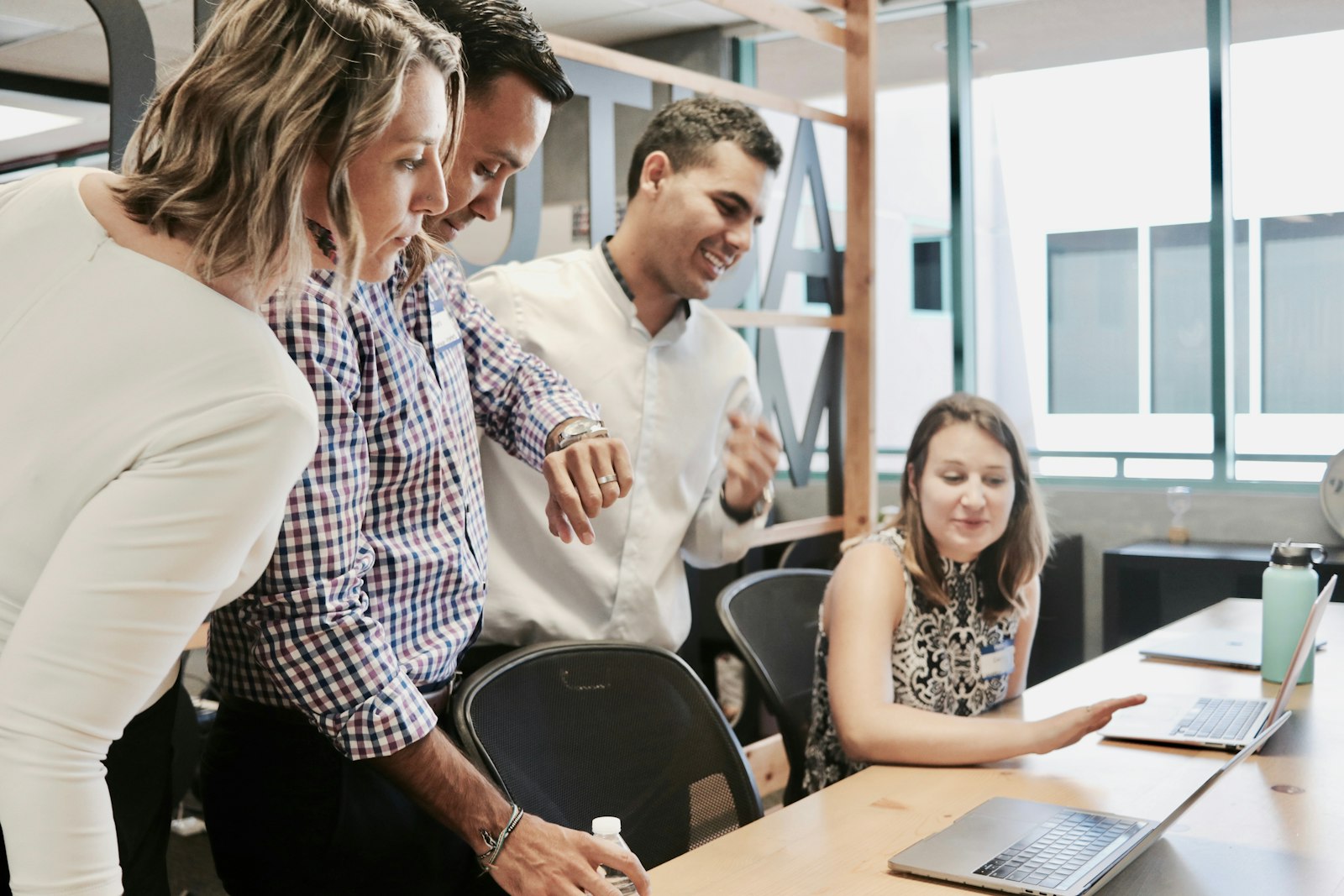 A workplace team reviewing group coverage options together